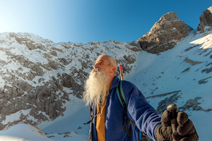 iStock-636900410 old man mountain snow guru